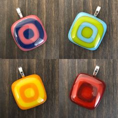 four square pendants with different colors on them