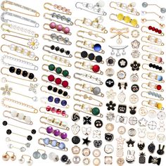 many different types of earrings are displayed on a white surface with clippings and pins