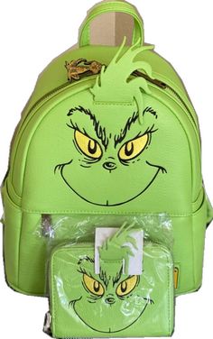 a green backpack with an angry grin face on it