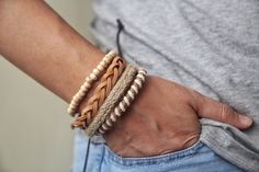 A set of 4 Boho style produced and handmade bracelets. Featuring Wood Bead, this bracelet stack includes handmade leather rope braided, adjustable, can be worn combined in different way what you want.  A combination of 4 handmade bracelets, curated by Alice as the perfect style set for him. Casual Brown Leather Beach Bracelet, Handmade Casual Beaded Bracelets For Vacation, Casual Beaded Leather Bracelet As A Gift, Casual Handmade Beaded Bracelets For Vacation, Handmade Brown Beaded Casual Bracelet, Casual Brown Handmade Beaded Bracelet, Handmade Brown Leather Bracelet For Beach, Handmade Casual Leather Bracelet For Everyday, Handmade Trendy Brown Wrap Bracelet