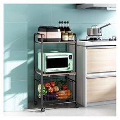 a microwave oven sitting on top of a metal rack next to a counter with fruits and vegetables in it