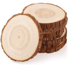 three pieces of wood stacked on top of each other in the shape of circles, with white background