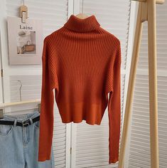 Essential turtleneck long sleeve sweater for fall/winter layering or wearing on its own. Chunky ribbed texture with lots of stretch. Meant to be a looser fit on size S/M or more fitted to the body on L/XL. One Size: 19.5" across shoulders, 38" chest, 20.5" length Burnt Orange Sweater, Orange Sweater, Ribbed Turtleneck Sweater, Fitted Turtleneck, Orange Sweaters, Turtleneck Long Sleeve, Winter Layering, Ribbed Turtleneck, Rust Orange