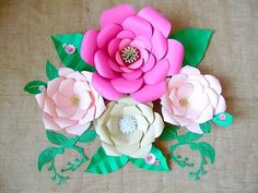 paper flowers are arranged on top of each other