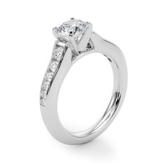 This delicate ring features 1/2 ctw. of radiant diamonds that extend down the band. A 0.25 ct. or larger center stone of any shape can be set with this ring. Promise Diamond Ring With Side Stones In Cubic Zirconia, Diamond Wedding Ring With Tension Setting And Princess Cut, Diamond Promise Ring With Side Stones, Timeless Square Cut Moissanite Diamond Ring, Princess Cut Diamond With Tension Setting For Wedding, Fine Jewelry Promise Ring With Side Stones, Cubic Zirconia Diamond Ring With Side Stones For Promise, Fine Jewelry Diamond Promise Ring With Side Stones, Radiant Cut Brilliant Lab Grown Diamond Ring