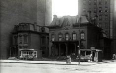 an old black and white photo of some buildings