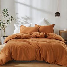 PRICES MAY VARY. 【Queen Size Package Includes】 3 Pieces Washed Linen Cotton Blended Duvet Cover Set:1 Duvet Cover (88" x 92"),2 Standard Pillowcases(20"x 26"). Note: Duvet insert and pillows are not included. 【Fabric Feature】Made of 55% Linen and 45% Cotton Fabric. Our Luxury linen blended duvet cover set retains rich texture of Linen, with soft touch and washed style. It has better moisture absorption and breathability than cotton fabric, which can ensure that you feel cool in summer and warm i Burnt Orange Comforter, Rust Bedroom, Brown Duvet Covers, Brown Comforter, Orange Comforter, Bedding Comforter Sets, King Size Comforter Sets, Orange Bedding, Bedding Comforter