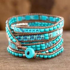 Soothing Teal Wrap Bracelet Crafted by Artisan Group - Soothing Teal | NOVICA Artisan Blue Adjustable Wrap Bracelet, Artisan Turquoise Hand Wrapped Wrap Bracelet, Artisan Hand Wrapped Turquoise Wrap Bracelet, Artisan Turquoise Wrap Bracelet For Festivals, Artisan Blue Wrap Bracelet As A Gift, Turquoise Beaded Bohemian Wrap Bracelet, Artisan Blue Wrap Bracelet Gift, Blue Spiritual Wrap Bracelet For Festival, Adjustable Turquoise Beaded Artisan Bracelets