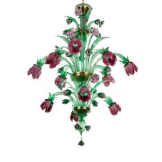 a green chandelier with pink flowers hanging from it's side on a white background