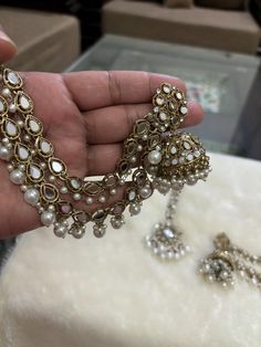 *Beautiful Premium Quality Long Earrings With Support Chain With Maangtikka *Combination Of Kundan and Monalisa Stones  *Front Side is Monalisa Stone With Kundan *Pearls And Kundan Are Of Original Quality *For More Beautiful Collection, Check At https://www.etsy.com/shop/placeoffashion *Earring Closure: Push Back *It is a Bridal or Partywear Earrings *It Will Give You a Unique and Beautiful Look  *You Can Wear This Beautiful Set At Dress or Saaree  *The Colour Combination Of This Set Is Very Uni Festive Jewelry Sets With Latkans For Eid, Festive Pearl Bridal Earrings With Tilla, Party Pearl Drop Chandbali Necklaces, Bridal Necklace With Latkans For Eid Celebration, Pearl Chandbali Temple Jewelry Jhumkas, Kundan Pearl Drop Jewelry Sets For Party, Pearl Chandbali Jhumkas In Temple Jewelry Style, Festive Kundan Chandbali Necklace With Pearl Drop, Festive Pearl Chandbali Danglers