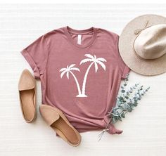 "Palm Tree Shirt, Palms Shirt, Summer Vacation T-Shirt, Palm Beach Shirt, Summer Tee, Botanical Shirt, Hawaii Shirt, Tropical Shirt ☀️☀️☀️☀️☀️ Everything in our shop is hand crafted and made to order. If you want different color or size contact me! If you would like something custom made to fit your personal style please message me and I will do everything to get you that something special. ---How To Order--- ⭐️Please, check and review all photos ⭐️Choose your t-shirt size and color ⭐️Enter your Summer Cotton T-shirt With Palm Tree Print, Casual White Printed Shirt, Casual Cotton Tops With Palm Tree Print, Casual Cotton Top With Palm Tree Print, Palm Tree Print Graphic Tee With Crew Neck, Cotton T-shirt With Palm Tree Print In Relaxed Fit, Cotton Crew Neck Top With Palm Tree Print, Relaxed Fit Cotton T-shirt With Palm Tree Print, Relaxed Cotton Top With Palm Tree Print