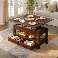 a coffee table with drawers and plates on it