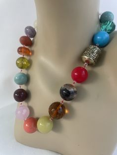 Semi Precious Necklace, hand knotted in red silk thread, 20 mm semi precious stone, 3 mm Swarovski crystal, 6 mm rock crystal with sterling silver findings and toggle. This colorful one of a kind necklace is 21 inches in length, weight is 6.4 oz, hand crafted in North Palm Beach, Florida by designer artist Christine Smith Jean Art, Rock Crystal Necklace, Formal Necklace, Semi Precious Necklace, Crystal Spikes, Long Tassel Necklace, Hematite Necklace, Precious Beads, Turquoise Bead Necklaces