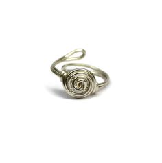 Wire wrapped Rose ring made in your choice of antique brass, gunmetal, or silver. Makes a great gift or stocking stuffer because you don't have to ask the receiver their ring size. It is one size fits most! Adjustable design made with 18g non tarnish wire. Rings are one size fits most and are adjustable. Ring appears larger in photos to show detail. Since each ring is handmade and gemstones vary in color tone and pattern, there may be slight differences in each ring. Your order will be made and Adjustable Rose Gold Metal Ring, Adjustable Rose Gold Midi Rings, Nickel Free Metal Rings For Gifts, Adjustable Spiral Nickel-free Jewelry, Adjustable Spiral Silver Midi Rings, Adjustable Spiral Midi Rings In Silver, Adjustable Silver Spiral Midi Rings, Nickel Free Metal Midi Rings For Wedding, Nickel-free Metal Midi Rings For Wedding