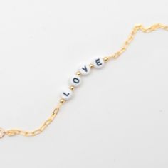 "* Gold Filled Chain * Love Bracelet -- Personalized with your name or message * Lenght: 6.75\" * Everything is made to order in our Miami Workshop, mostly material sourced in USA. * We ship with a beautiful jewelry pouch for gift giving and safe keeping of your jewelry. * We process most orders within 1 business day. * All orders are shipped via USPS First Class Mail with tracking number. * We ship internationally using USPS First Class International Mail with tracking number. * You are welcome Trendy Charm Bracelet With Delicate Chain As Gift, Modern Letter Beads Jewelry For Gifts, Modern Letter Beads Jewelry As Gift, Elegant Letter Beads Charm Bracelet As Gift, Elegant Bracelets With Letter Beads For Gifts, Elegant Friendship Bracelet With Letter Beads, Elegant Letter Beads Bracelet For Gift, Minimalist White Chain Bracelet As A Gift, Minimalist White Chain Bracelet For Gift