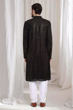 Black cotton kurta with sequin work embroidery. Paired with solid churidaar. - Aza Fashions Party Wear Kurta With Resham Embroidery For Festivals, Party Wear Long Sleeve Kurta For Festive Occasions, Festive Party Wear Straight Kurta, Festive Long Sleeve Party Wear Kurta, Festive Long Sleeve Party Kurta, Party Wear Kurta With Mirror Work, Party Wear Long Sleeve Kurta With Mirror Work, Long Sleeve Party Wear Kurta With Mirror Work, Celebration Kurta With Mirror Work And Fitted Style