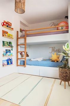 there is a bunk bed in the room with books on the shelves and a plant next to it