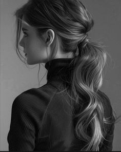 a woman with long hair in a ponytail