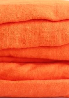 an orange cloth folded on top of each other