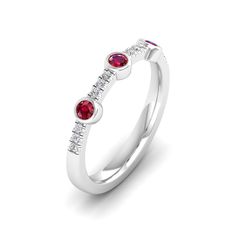 This exquisite diamond and ruby ring is a stunning piece of jewelry that exudes elegance and sophistication. The brilliant diamonds and vibrant rubies are set in a beautifully crafted, creating a luxurious and eye-catching design that is sure to make a statement. Metal: 14K Gold Setting Type: Prong Rhodium Finish: Yes, on White Gold Gemstone Details: Gemstone: Ruby Shape: Round Average Dimensions: 2.50 MM Quantity: 03 Average Cut: Very Good Average Color: Medium to Dark Red Average Clarity: Eye Luxury Diamond Ring With Lab-created Ruby Accents, Red Ruby Diamond Multi-stone Ring, Red Ruby Multi-stone Ring With Diamonds, Lab-created Ruby Diamond Ring With Round Cut, Ruby And Diamond Multi-stone Round Ring, Elegant Red Diamond Ring With Single Cut Diamonds, Elegant Red Multi-stone Birthstone Ring, Anniversary Ruby Ring With Diamond White Color, Elegant Ruby Ring With Diamond Bezel Setting