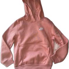 Sports Hoodie With Kangaroo Pocket In Pink, Nike Solid Color Hooded Sweatshirt, Nike Hooded Top With Drawstring, Nike Fleece Top With Adjustable Hood, Nike Long Sleeve Hoodie, Pink Sweatshirt With Kangaroo Pocket For Spring, Pink Hooded Top With Kangaroo Pocket, Nike Tops With Adjustable Hood For Fall, Nike Top With Adjustable Hood For Fall