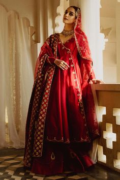 Pakistani Wedding Dress in Pishwas and Lehenga Style in premium quality fabric is the epitome of grace and beauty. The stunning Pishwas Dress comes in Angrakha style and is adorned with beautiful embroideries and goldwork, making it a perfect choice to wear on the big day. Pishwas Frock: Pakistani Pishwas Frock in an alluring red shade has premium raw silk fabric. The delicate embroideries on this Pishwas in Angrakha Frock style make it an epitome of beauty. Zardosi and crystals give a perfect finishing look to the stunning Pakistani Wedding Dress. Wedding Lehenga: Pishwas Frock is paired with Lehenga, creating a lavish Pakistani Wedding Dress. The Red Lehenga comes in raw silk fabric. The Lehenga has a massive flare and is emblazoned with graceful designs and goldwork, making it a chic ch Bollywood Sherwani With Intricate Embroidery In Georgette, Reception Sherwani With Intricate Embroidery, Bollywood Style Semi-stitched Georgette Sherwani, Festival Chinon Sherwani With Dupatta, Wedding Sherwani With Dupatta In Chinon, Wedding Sherwani With Intricate Embroidery In Chinon, Festival Sherwani With Dupatta In Chinon, Festive Anarkali Style Sherwani In Chinon, Wedding Sherwani With Dupatta In Georgette