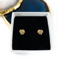 These pretty gold rose stud earrings make the perfect little gift for young or old. Great for a birthday or thank you gift. Dimensions: 0.7cm x 0.7 cm. (Rose excluding pin)Earrings will be delivered in an Aspreys & Clarke Gift box. For that extra special touch you can personalise the gift box. The box lid can be completed with an engraved plaque, allowing you to add a message up to 120 characters in length.This product will be engraved using ‘Georgia’ font unless otherwise stated. Gold Nickel-free Flower Earrings As Gift For Her, Gold Rose Design Earrings For Anniversary, Formal Gold Flower Earrings With Rose Design, Gold Earrings With Rose Design For Gift, Gold Earrings With Rose Design As Gift, Elegant Rose Design Earrings For Gift, Gold Rose Flower Earrings, Elegant Gold Rose Flower Earrings, Formal Gold Earrings With Rose Design