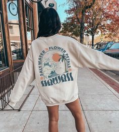 Get ready for summer in style with the Hawaii Hibiscus Flower Sweatshirt, featuring an oversized, trendy Y2K vibe that perfectly combines preppy clothing with a beachy, coconut girl aesthetic. Whether you're looking for a cozy crewneck sweater or a statement piece to layer over your summer shirts, this sweatshirt is a must-have for any VSCO girl wardrobe.   *USUALLY SHIPS WITHIN 1-4 DAYS* -Gildan crewneck sweatshirt -For oversized look size up 1-2 sizes -Comfy & Cozy -Ink designs -Collar is ribb Vsco Style Relaxed Fit Sweatshirt With Letter Print, Trendy Letter Print Sweatshirt For Beach, Trendy Sweatshirt For Beach In Spring, Summer Vacation Cotton Hoodie, Trendy Spring Beach Sweatshirt, White Cotton Vsco Sweatshirt, Cotton Hoodie For Summer Vacation, White Cotton Hoodie For Beach, White Cotton Hoodie For The Beach