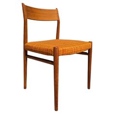 a wooden chair with an orange upholstered seat and back rest on a white background