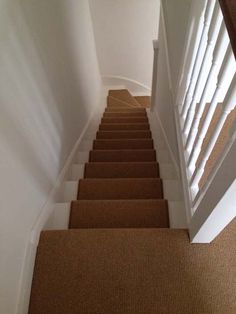 a staircase with carpeted steps leading up to the top