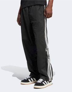 Pants & Chinos by adidas Originals Off-duty mood Regular rise Elasticated drawstring waist Side pockets adidas branding Press-stud side panels Relaxed fit Adidas Branding, Classic Adidas, Adidas Fashion, Winter Party Dress, Spring Floral Dress, Sports Pants, Black Long Sleeve Dress, Jumpsuit Shorts Rompers, Leg Design