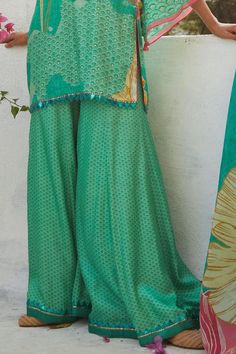 Aqua gajji satin kurta with floral print and sequins embroidery. Comes with sharara and an organza dupatta. - Aza Fashions Festive Sharara With Bandhani Print, Green Sharara With Traditional Drape For Summer, Green Traditional Drape Sharara For Summer, Green Silk Bohemian Sharara, Bohemian Green Silk Sharara, Green Bohemian Silk Sharara, Chanderi Sharara With Bandhani Print, Eid Bandhani Print Palazzo Set For Designer Wear, Eid Designer Palazzo Set With Bandhani Print