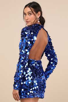 Why look merely glamorous when you can embrace extravagance in the Lulus Brilliant Behavior Royal Blue Sequin Backless Mini Dress! Shimmering sequins and even shinier paillettes dance across this perfect party dress that features a mock neckline and long sleeves with padding at the shoulders. The flirty bodycon silhouette will effortlessly flaunt your figure as it falls to a cute mini hem. Button-loop closures secure above a open-back cutout that lends an alluring finish. Hidden back zipper/clasp. Fit: This garment fits true to size. Length: Above mid-thigh. Size medium measures 33" from shoulder to hem. Bust: Great for any cup size. Waist: Fitted - very fitted at natural waist. Hip: Fitted - stretchy fabric allows room for hips. Undergarments: May be worn with an adhesive bra, petals, or Royal Blue Sequin Dress, Royal Blue Party Dress, Mini Dress Sequin, Blue Sequin Dress, Concert Dresses, Dress With Open Back, Dress Sequin, Adhesive Bra, Backless Mini Dress