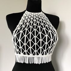 Macrame Handmade Top - a white masterpiece designed for parties, beach celebrations, vacations, and festival looks. This versatile top is your ideal choice for making a statement at any festive occasion, providing the perfect blend of style and comfort. Elevate your wardrobe with this must-have piece, also perfect as a festival white top for those special moments. Information: * Material: polyester cord. * Color: white - ready to ship.  * Size: s-m size * Handmade by myself in Lithuania, Europe. White Halter Neck Top For Party, White Beachwear Halter Top For Party, White Halter Neck Top For Beach Season, White Fitted Halter Top For Party, White Fitted Halter Neck Crop Top, Fitted White Halter Top For Party, White Halter Neck Crochet Top For Beach Season, White Halter Neck Top For Beach, White Crochet Top For Summer