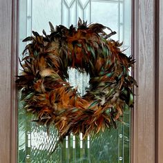 a wreath is hanging on the front door