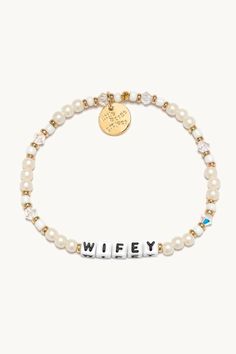 Let’s celebrate all the wifeys in our lives! Gift this handcrafted faux pearl bracelet to the girlie who’s about to wed her prince charming or the woman who’s been happily married for two decades. Part of a Bigger Story: Little Words Project is all about spreading kindness and empowerment through words. By wearing this bracelet, you become part of a larger community that shares the power of words. Bead Pattern: Bling Bling Hand-crafted, faux pearl and crystal beaded bracelet Plated Brass Hardwar Adjustable Pearl Charm Bracelet For Wedding, Elegant White Bracelet For Bridal Shower, White Name Bracelet For Wedding, Personalized White Bangle Jewelry, Elegant Letter Beads Bracelet, Pearl Charm Bracelet For Wedding, Elegant White Charm Bracelet For Mother's Day, White Jubilee Bracelet For Party, White Charm Bracelet For Mother's Day