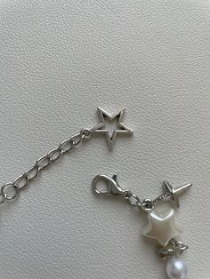 These beautiful bracelets are handmade and are available in 4 different styles -  ☆ Stargirl No Charms ☆ Stargirl + Charms ♡ The Stargirl Bracelet features faux pearl beads in a lustrous finish, combined with zinc alloy charms in the shape of delicate stars.  ♡ If you are looking for a more dainty and subtle look then the 'NO Charms' style is for you. But if you want  to elevate your style even further you can choose the '+ Charms' style.  ♡ Both bracelets offer a chic and elegant design. The combination of materials make them comfortable and perfect for everyday wear, and ideal as gifts during any special occasion!  !!Please note that the price is for ONE bracelet!! ----------------------------------------------------------------------  Sizing!  ♡ Our bracelets are around 18.5cm long. If Trendy Star-shaped Jewelry For Friendship, Trendy Star-shaped Friendship Jewelry, Trendy Silver Star Charm Bracelet, Trendy Handmade Star-shaped Bracelets, Star-shaped Metal Bracelets As Gifts, Trendy Star-shaped Handmade Bracelets, Trendy Handmade Star Bracelets, White Star Bracelets For Friendship, Star-shaped Beaded Friendship Jewelry