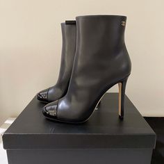 Brand New Chanel Short Boots In Calfskin Leather With Patent Leather Front In Black. Cc Logo On Top. Including Original Box And Dustbag. Size Eu 40 Designer Patent Leather Heeled Boots With Reinforced Heel, Luxury Business Ankle Boot Heels, Luxury Ankle Boot Heels For Business, Luxury Calf Leather Evening Boots, Luxury Calf Leather Heeled Boots For Party, Luxury Heeled Boots For Workwear, Luxury Heeled Boots For Galas, Luxury Ankle Heeled Boots For Office, Luxury Patent Leather Heeled Boots For Evening