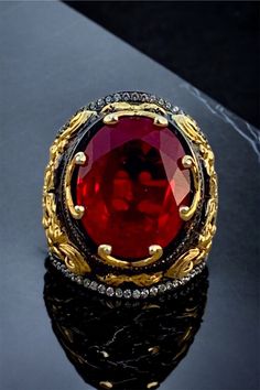 Luxury Handmade Ruby Ring, Luxury Formal Ruby Ring With Stone Setting, Luxury Ruby Ring With Stone Setting For Formal Events, Luxury Ruby Ring With Stone Setting For Formal Occasions, Luxury Handmade Ruby Ring For Formal Occasions, Luxury Hallmarked Red Rings, Ceremonial Red Gemstone Ring, Luxury Red Oval Rings, Red Gemstone Rings For Ceremonial Occasion