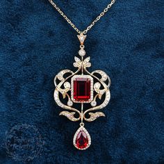 "Jewelry Details -Gold Type : 14k gold -Center Stone1: Lab Created Ruby 8*11mm, Approximately 3.85ct Color: Red--- 5A Clarity: VVS Cut: Emerald Cut / 3EX -Center Stone2: Lab Created Ruby 6*9mm, Approximately 1.5ct Color: Red--- 5A Clarity: VVS Cut: Pear Cut / 3EX -Side Stone: 0.84cttw moissanite Color: EF Clarity: VVS1 Cut: Round Cut / 3EX -Pendant Width: 27mm -Pendant Height: 57mm -Chain Length: 40+3+3cm SKU: YP0010-2 ~*-*~Purchase Guarantee: - All our jewelry is handmade, and each process is refined. - 14 Day Refund Guarantee. - All our products are Free Shipping. - Free Gift Box&Packing. ~*-*~Please contact us if you need service: 1. Ring Resizing. 2. Metal Change(PT950/10k/14k/18k White/Yellow/Rose Gold). 3. Engraving ring (less than 10 letter). 4. Accept customization. We believe that Vintage Ruby Pendant Jewelry, Red Pendant Necklace With Intricate Design, Square Ruby Necklace, Red Ruby Necklace With Intricate Design, Antique Ruby Pendant, Luxury Ruby Pendant Jewelry, Ruby Jewelry Necklaces, Pendant Necklace Vintage, Lab Created Emerald