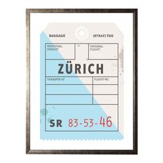 a blue and white luggage tag hanging on a wall next to a black framed frame