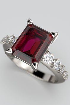 Italian Gold engagement ring with natural Rhodolite garnet emerald cut and natural Diamonds, made in Italy in 14k or 18k gold by Oltremare Gioielli. Timeless Emerald-cut Ruby Ring, Luxury Ruby Gemstone Ring In Platinum, Elegant Radiant Cut Emerald Ring, Luxury Diamond Cut Gemstones For Formal Occasions, Timeless Emerald Ring With Accent Stones For Formal Occasions, Luxury Platinum Ruby Ring With Prong Setting, Timeless Sapphire Ring With Accent Stones For Formal Occasions, Timeless Formal Emerald Ring With Accent Stones, Elegant Sapphire Ring With Moissanite Center Stone