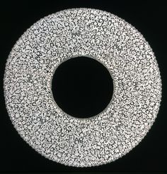 a circular object made out of small white dots