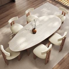 a dining table with six chairs and a vase on it in the middle of a room