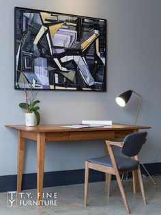 A solid wood desk and matching chair, with a desk lamp on the tabletop and a painting on the wall Wood Desk Home Office, Desk Japanese, Rough Sawn Lumber, Desk Oak, Walnut Desk, Wood Computer Desk, Desk Computer, Artisan Furniture, Solid Wood Desk