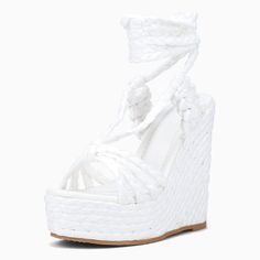 Elevate your summer style with these chic white wedge sandals. Featuring a raffia braided strappy design and lace-up closure, these platform sandals offer both fashion and comfort for any occasion. Color: White Material: Raffia Heel Type: Wedge heel Heel Height: 5'' / 127 mm approx Platform Height: 2'' / 50 mm approx Product measurements were taken using size 8. Please note that measurements may vary by size. Toe: Open toe Braided strappy design Lace-up design Handcrafted US sizing. Fits true to White Wedge Heels, White Wedge Sandals, Flat Wedges, White Wedges, Platform Wedge Sandals, Platform Wedge, Heel Type, White Material, Platform Wedges