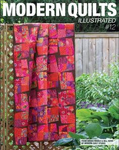 the cover of modern quilts illustrated, featuring an orange and pink quilt on a wooden fence