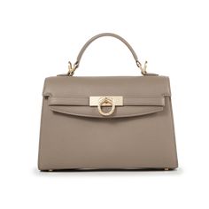 Inspired by Grace Kelly's enduring style, the Grace Top Handle Bag is meticulously crafted from premium USA full-grain textured calfskin leather, ensuring both durability and elegance. Its timeless and versatile design features a thoughtfully structured interior that comfortably accommodates all your everyday essentials. Whether day or night, you'll find yourself instinctively reaching for this chic and easy-to-wear masterpiece. Elegant Satchel Flap Bag In Textured Leather, Elegant Textured Leather Satchel Flap Bag, Elegant Textured Leather Satchel Bag, Elegant Textured Calf Leather Bags, Elegant Textured Leather Shoulder Bag For Daily Use, Elegant Textured Leather Shoulder Satchel, Elegant Textured Leather Satchel For Formal Occasions, Elegant Beige Calf Leather Bags, Timeless Flap Bag For Daily Use