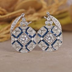 Antique Edwardian 14K White Gold Earrings/ Floral Ear Wire Earrings/ Edwardian Sapphire Earrings/ Round White Diamond Engagement Earrings 💎 𝐄𝐀𝐑𝐑𝐈𝐍𝐆𝐒 𝐈𝐍𝐅𝐎𝐑𝐌𝐀𝐓𝐈𝐎𝐍: ✪ All Stone Type: Simulated Diamond ✪ All Stone Shape: Round Cut  ✪ Color: D/E (Colorless) ✪ Clarity: IF (Internally Flawless) ✪ Cut Grade: Excellent ● 𝐌𝐄𝐓𝐀𝐋 𝐃𝐄𝐓𝐀𝐈𝐋𝐒: ✪ Metal Type:- 𝟗𝟐𝟓 𝐒𝐢𝐥𝐯𝐞𝐫 / 𝟗𝟑𝟓 𝐀𝐫𝐠𝐞𝐧𝐭𝐢𝐮𝐦 𝐬𝐢𝐥𝐯𝐞𝐫/ 𝟏𝟎𝐊𝐓/𝟏𝟒𝐊𝐓/𝟏𝟖𝐊𝐓 𝐒𝐨𝐥𝐢𝐝 𝐆𝐨𝐥𝐝/𝗣𝗹𝗮𝘁𝗶𝗻𝘂? Art Deco Dangle Earrings For Anniversary, Art Deco Hallmarked Drop Earrings, Hallmarked Art Deco Earrings For Anniversary, Heirloom Jewelry With Matching Earrings For Anniversary, Art Deco White Gold Earrings For Gift, Sterling Silver Heirloom Earrings For Anniversary, Heirloom Sterling Silver Earrings For Anniversary, Heirloom Sterling Silver Anniversary Earrings, Art Deco Anniversary Drop Earrings