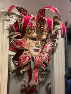 Beautiful Original Venetian jester mask made of paper mache (papier mâché) . The face of the Jester mask is decorated with playing cards, antique crackling and a gold trim. The Pointed headpiece is made of red velvet and it has golden bells. This is a piece of art for your wall. also it can be used for carnival, bal masque, costumed ball and theme parties. exclusive wall decoration . This mask is also a beautiful christmas decoration for your house and a unique holiday gift. Venetian Masks For Carnival Themed Events, Venetian Masks And Prosthetics For Carnival, Venetian Masks For Themed Carnival Events, Venetian Masks And Prosthetics For Mardi Gras, Artistic Red Masks For Costume Party, Artistic Red Mask For Costume Party, Artistic Red Masks And Prosthetics For Costume, Red Full Face Mask For Masquerade, Full Face Red Mask For Masquerade